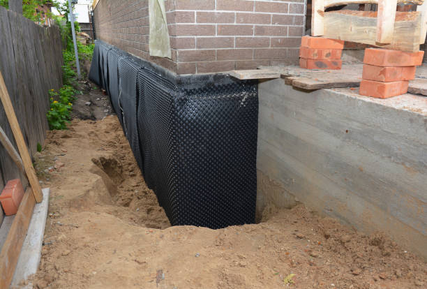 Happy homeowners after waterproofing job in Massapequa